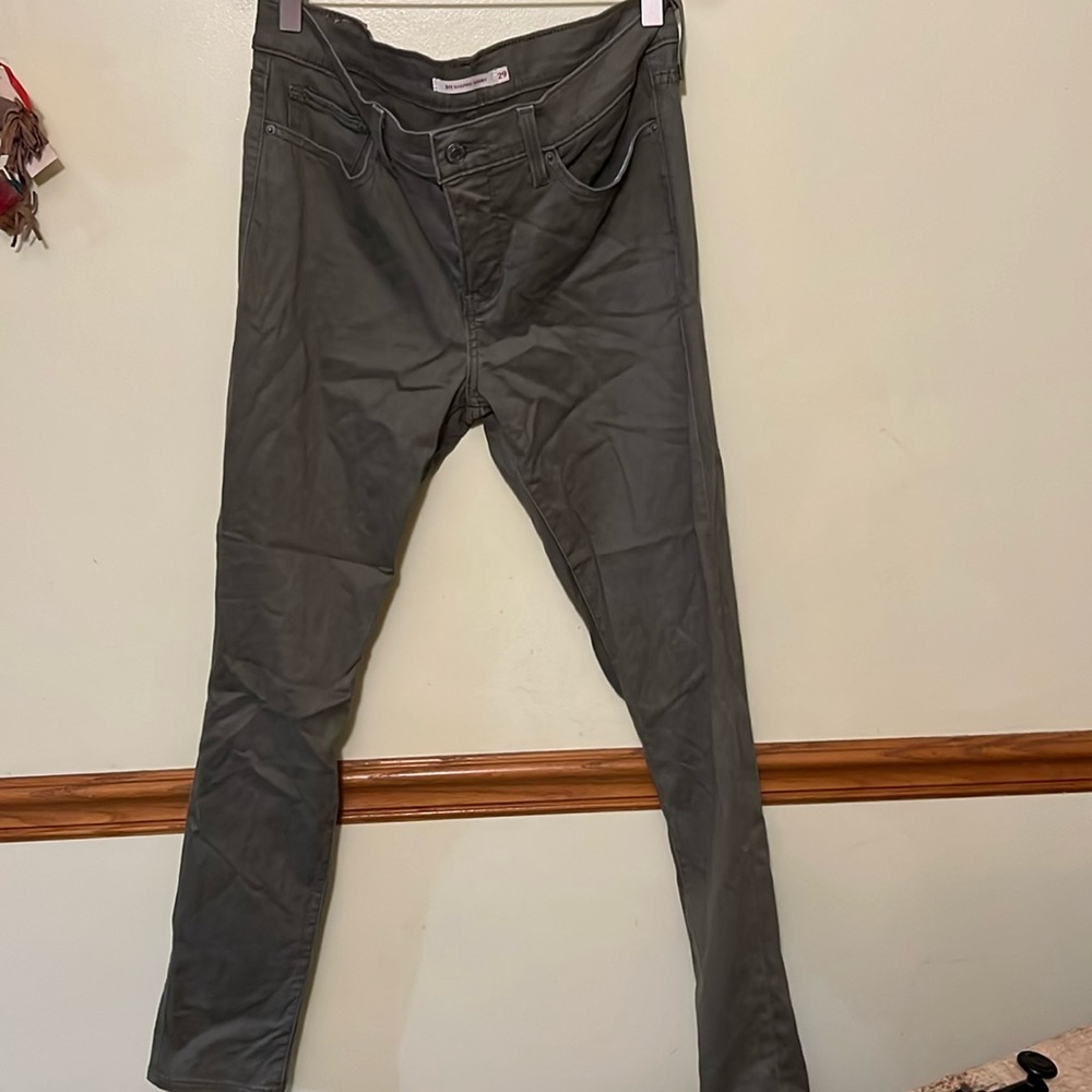 Levi’s 311. Army green size 29. Coated jean. 30 in length.